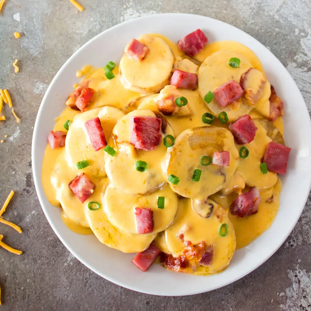 Creamy cheesy and quite simply the best au gratin potatoes with diced ham recipe