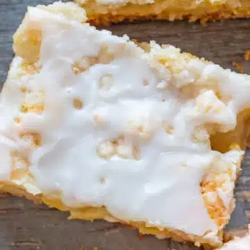 Wide closeup on sliced pineapple bars with icing.