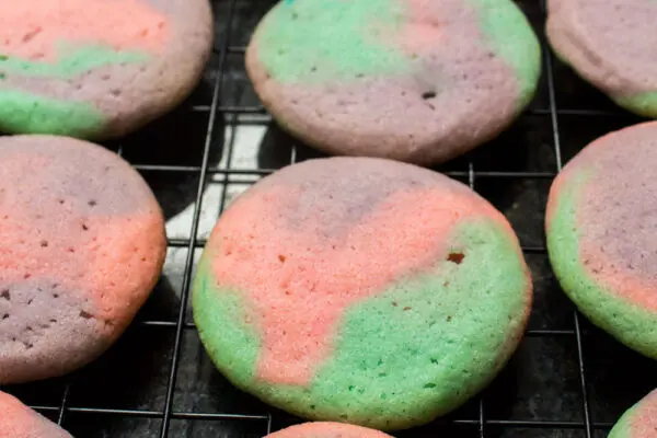 pastel colored double sugar cookies ready to be filled with buttercream frosting for double sugar cookie sandwiches