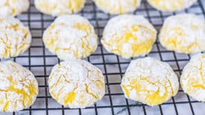 Luscious lemon cream cheese crinkle cookies perfectly baked until puffy and chilling before sharing.