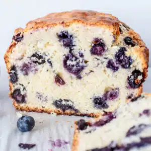 Best blueberry muffin bread sliced and ready to serve while warm with melted butter.