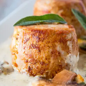 Delicious, tender pork tenderloin filets are pan seared until golden and set aside while the pan juices are used to make this rich, creamy mushroom gravy!