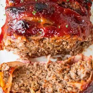 Delicious bacon wrapped meatloaf with a tangy ketchup sauce coating that is cooked to perfection!