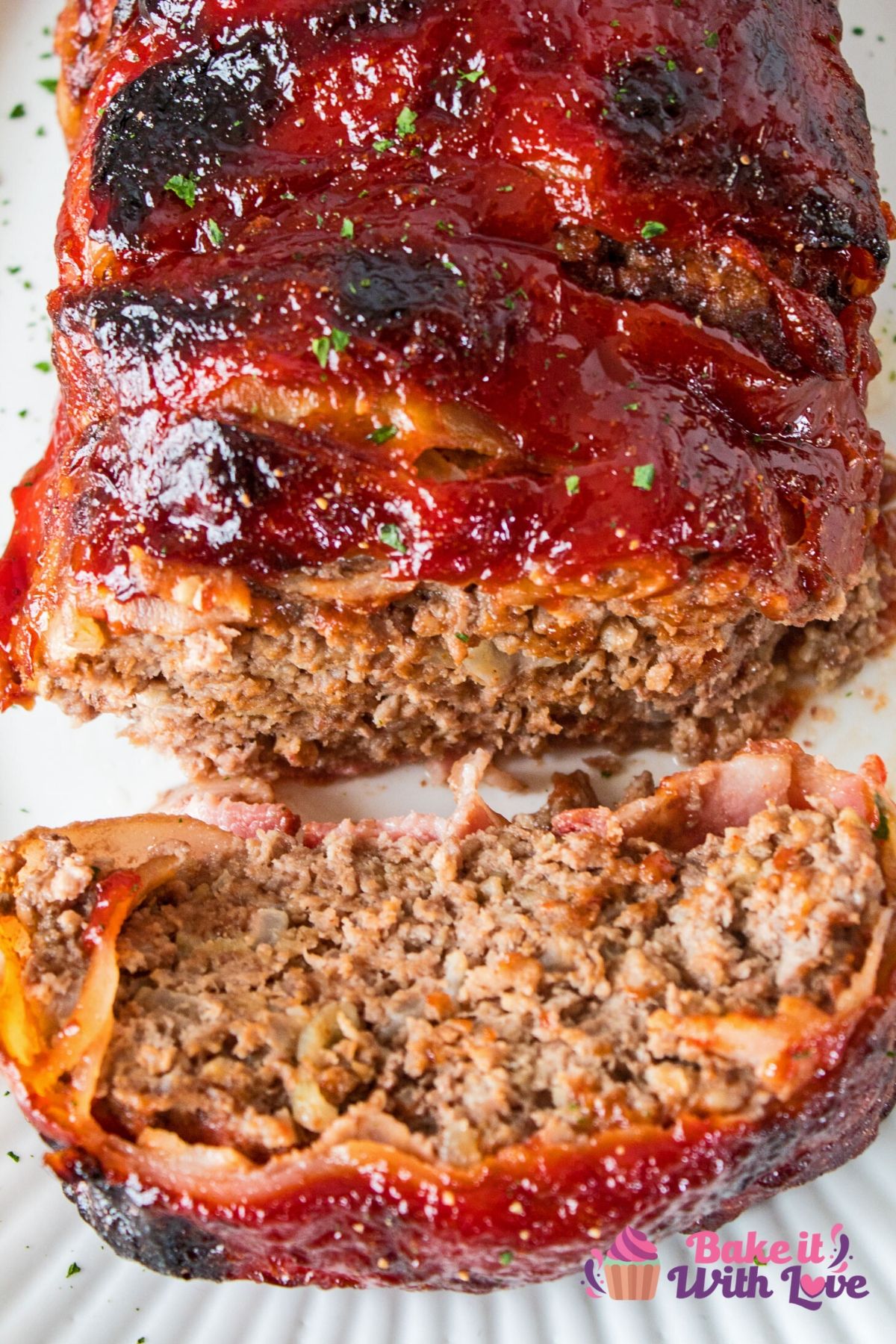 Delicious bacon wrapped meatloaf with a tangy ketchup sauce coating that is cooked to perfection!