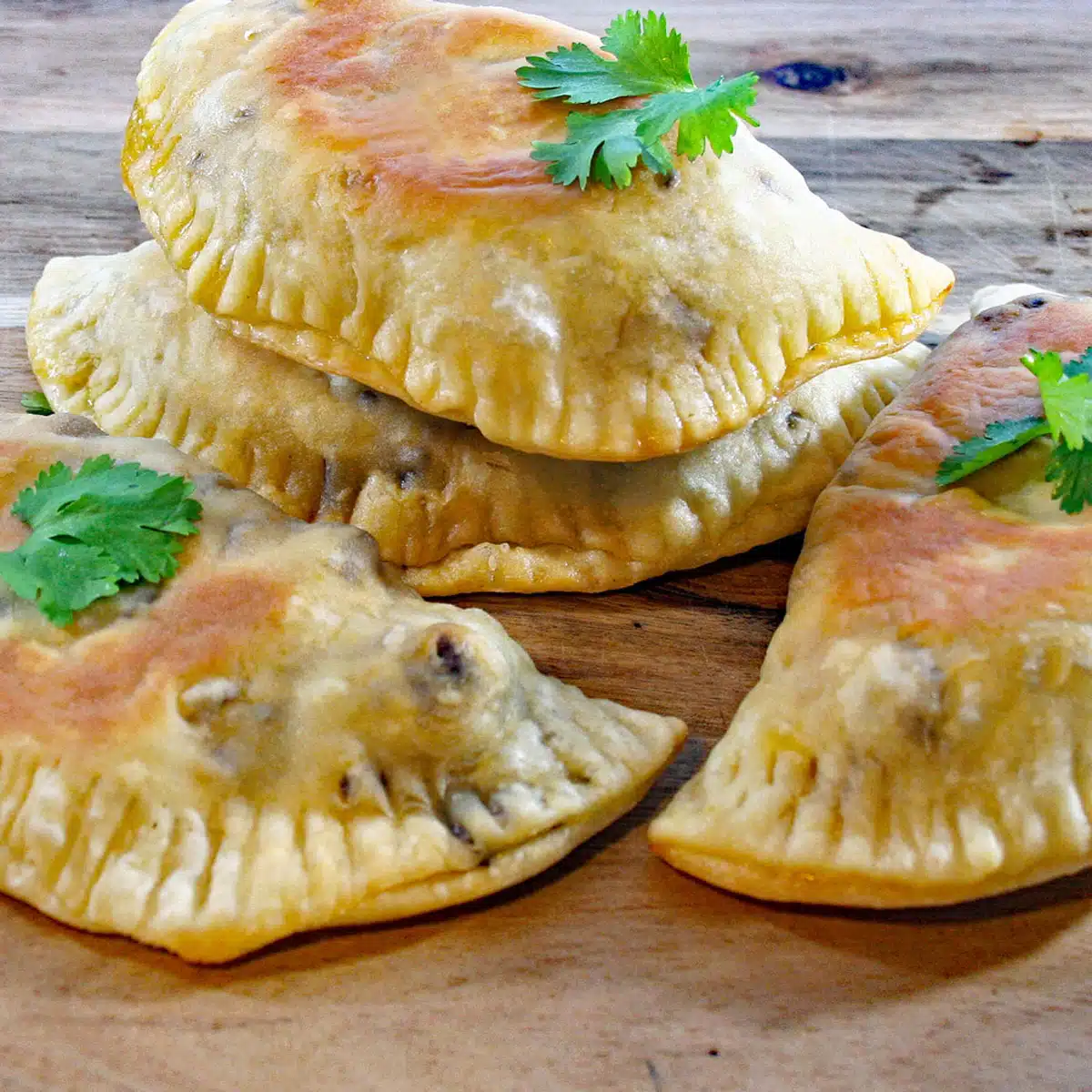 Square image of beef empanadas.