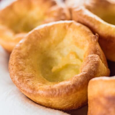 Large square closeup image of yorkshire puddings.