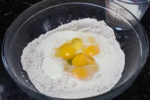 1 Dry ingredients whisked with eggs and first half of milk.