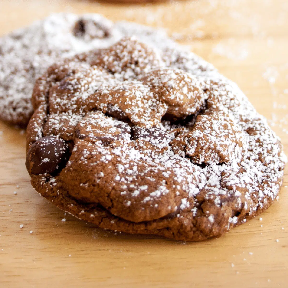 Dark chocolate cookies covered in powder sugar.