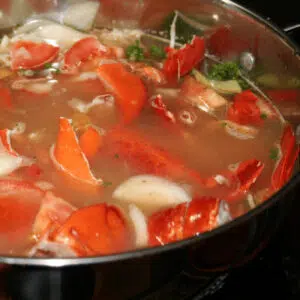 Square image showing lobster stock being made.