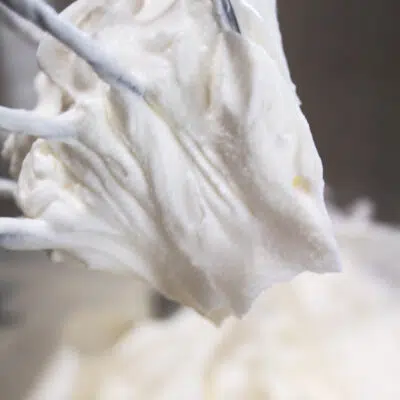 Large photo of stabilized whipped cream on a whisk.