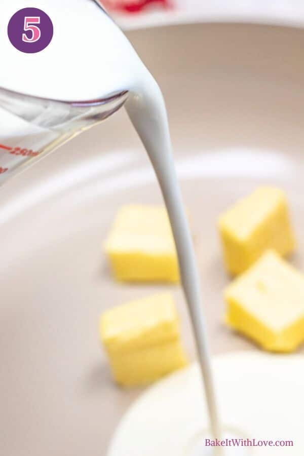 Lemon butter cod process photo 5. A stream of cream is being poured from a clear measuring cup into a light-colored pan containing four distinct cubes of yellow butter. The butter pieces are evenly spaced in the pan. A purple circle with the number "5" is in the upper left of the image.