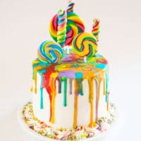 Rainbow Lollipop Drip Cake, 6 inch round 4 layer vanilla cake with royal icing drip and rainbow lollipops