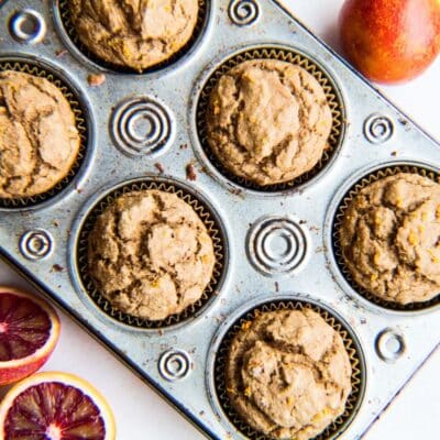 Blood orange muffins in pan.