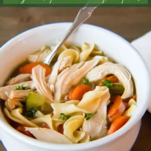 Pin image with text of chicken noodle soup in a white bowl.