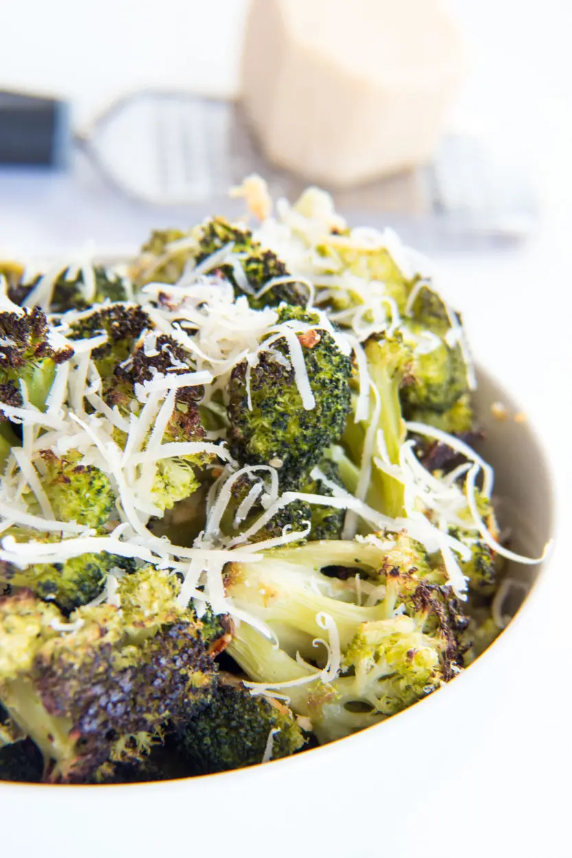 Easy Roasted Broccoli with Garlic and Parmesan in a white bowl.