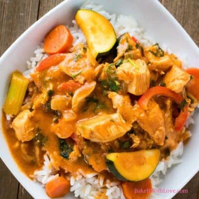 Square image of leftover turkey curry over white rice.