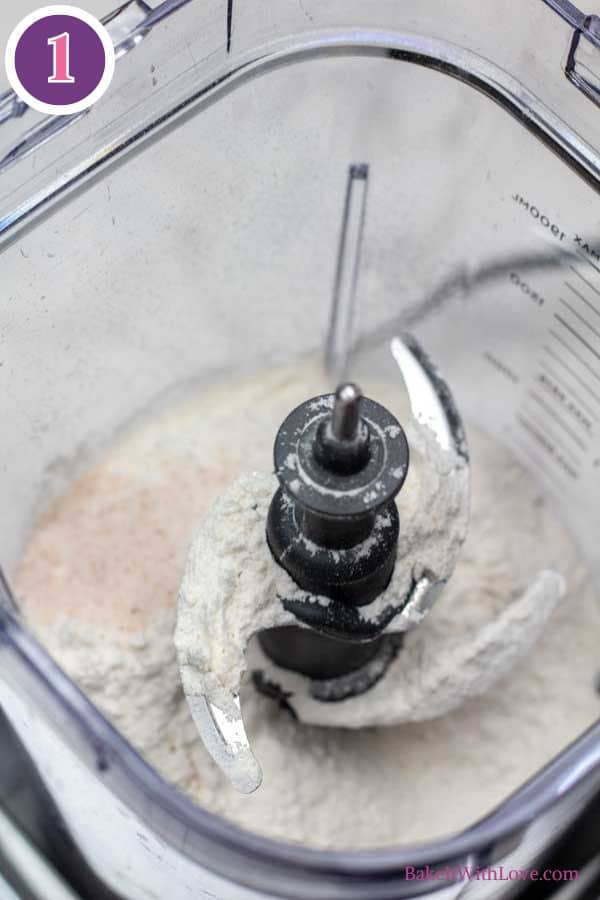 All butter pie crust process photo 1 showing salt and flour combined in a food processor.