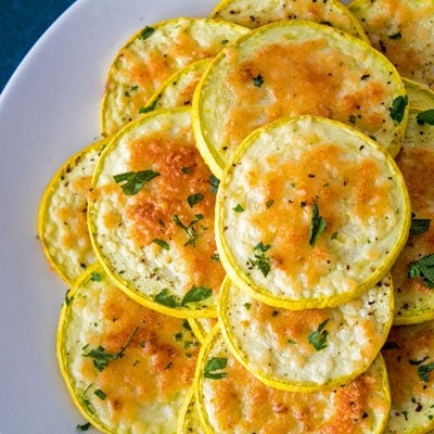 Simply delicious, golden baked Parmesan coated yellow squash rounds are the perfect anytime snack or side dish!!