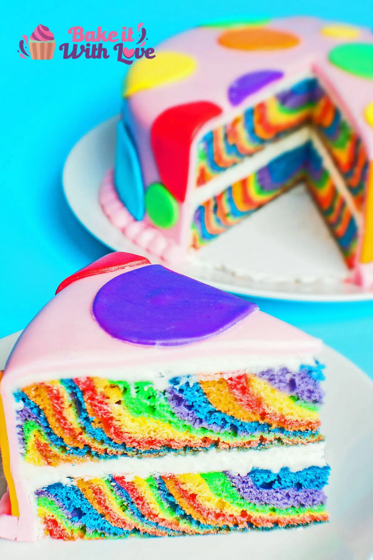 Vertical image of sliced one pan rainbow layer cake with buttercream filling and fondant layer.