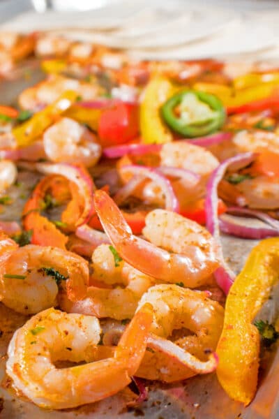 These sheet pan shrimp fajitas are an amazingly easy, tasty, and healthy dinner the whole family will love!