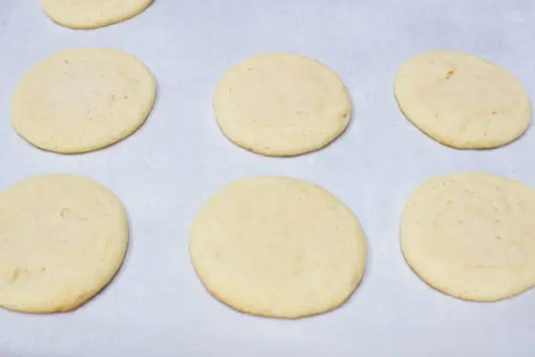 My super soft double sugar cookies baked and cooling on the baking sheet before transferring to a wire cooling rack