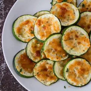 These super easy oven baked parmesan zucchini rounds are a delicious and healthy snack or side to enjoy at any time!