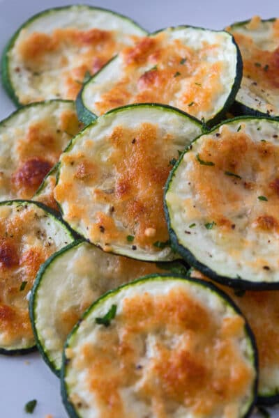 These super easy oven baked parmesan zucchini rounds are a delicious and healthy snack or side to enjoy at any time!