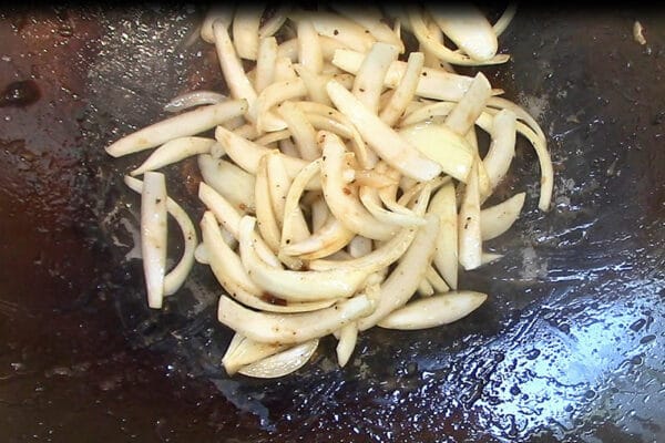 stir fry onions first after transferring cooked chicken breast to a plate