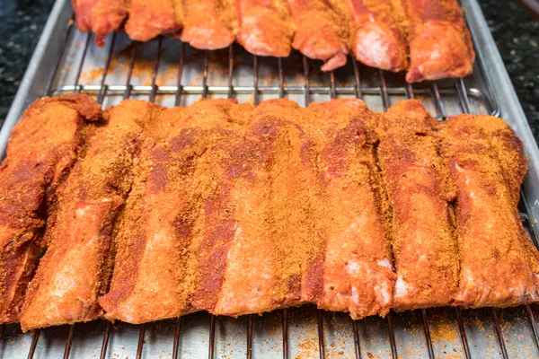 beef back ribs with dry rub seasoning before smoking.