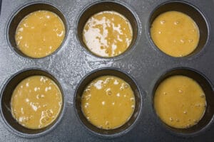 Honey cakes batter portioned out into 12 cupcakes.