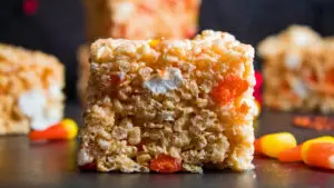 wide straight on image of a cut candy corn rice krispie treat.