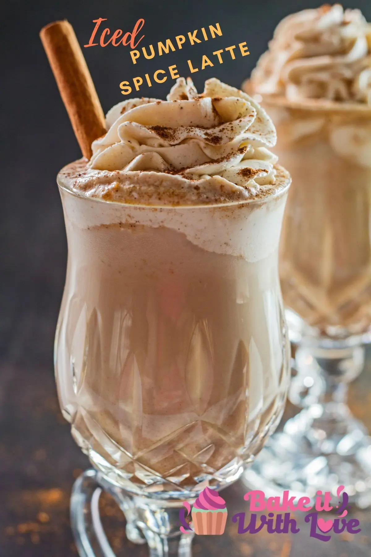 Closeup image of iced pumpkin spice latte with whipped cream.