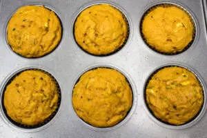 Baked pumpkin zucchini muffins removed from oven.