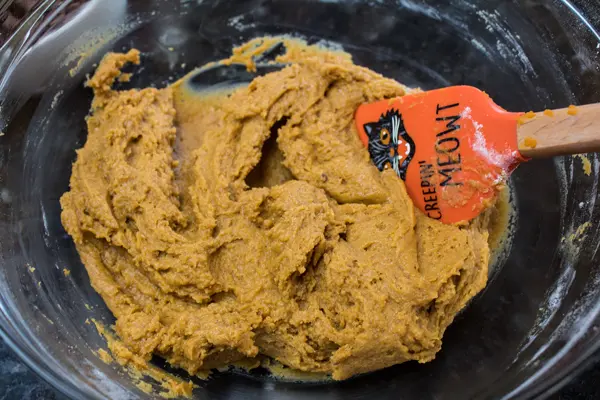 wet and dry ingredients combined to pumpkin cookie dough.
