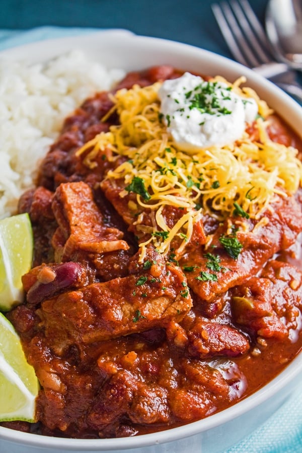 tall closeup overhead of the dished prime rib chili over rice.