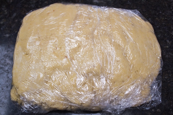 pastry dough formed into a disc and wrapped with plastic cling film.