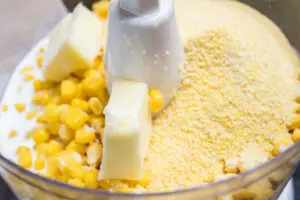 sweet corn, heavy cream, cornmeal, and butter in food processor.
