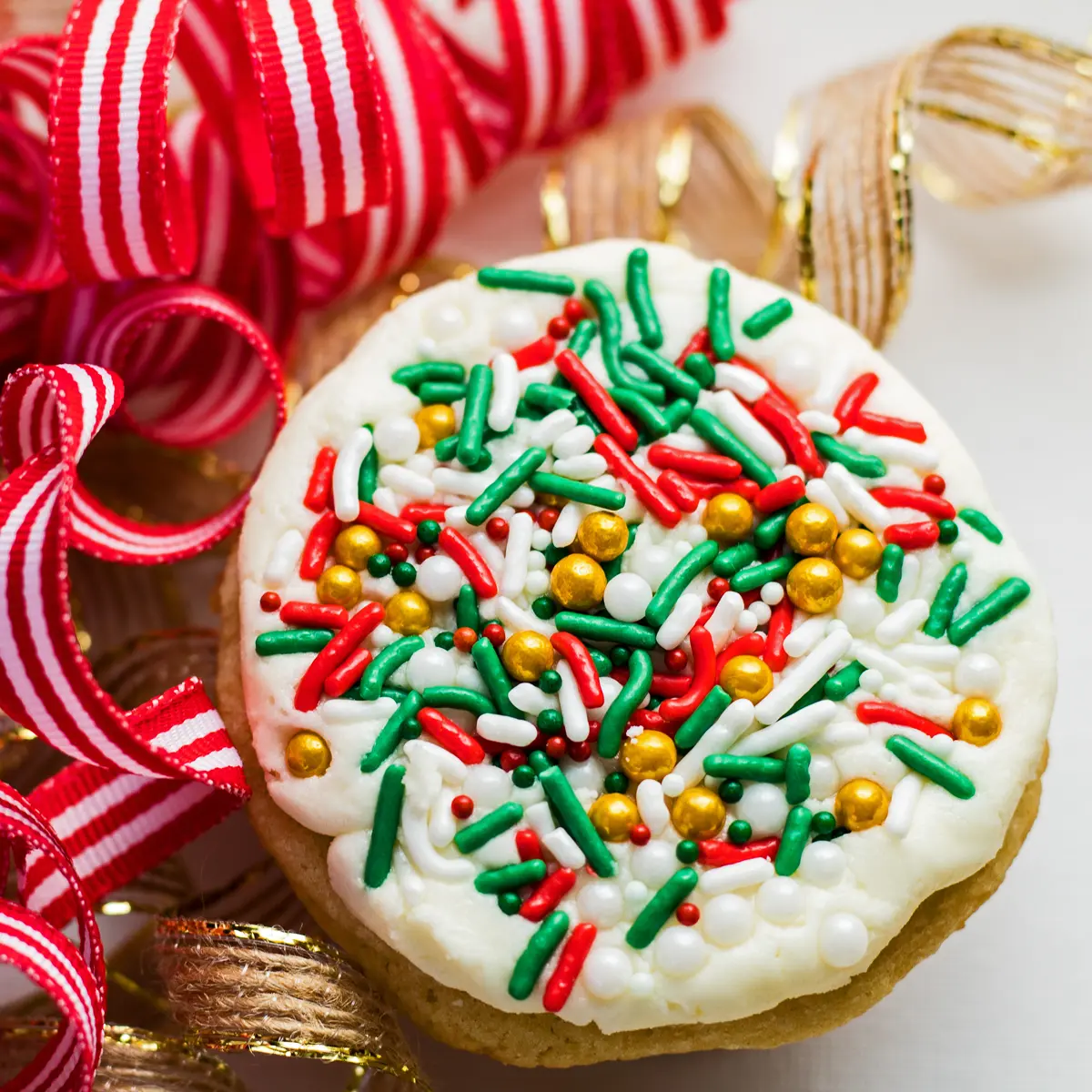 large square overhead image of Christmas cookies in ribbons.
