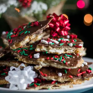 large square sideview image of christmas crack saltine toffee.