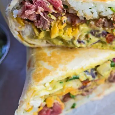 pin with vertical overhead image of the stacked cut leftover prime rib burritos.