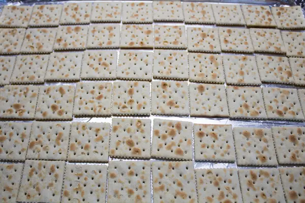 saltines in a single layer on baking sheet.