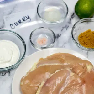 large square image of easy Curry Chicken Marinade comes together with 4 ingredients.