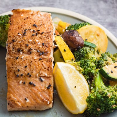 Large square hibachi salmon served with hibachi vegetables.