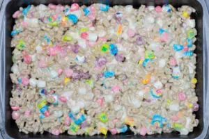 Lucky Charms marshmallow treats transferred into buttered 9x13.