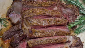 Wide closeup of the sliced tomahawk ribeye steak after reverse sear.