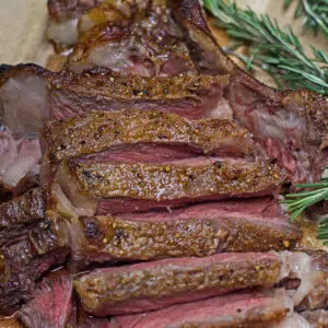 Large square of the reverse seared tomahawk ribeye steak.