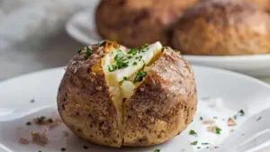 Wide image of the perfect smoked baked potato.