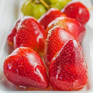large image tanghulu strawberries and more on serving tray.