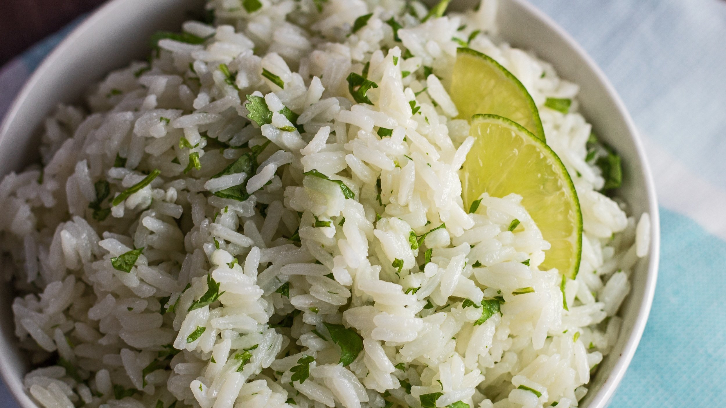Overhead closeup of the instant pot cilantro lime rice in white bowl.