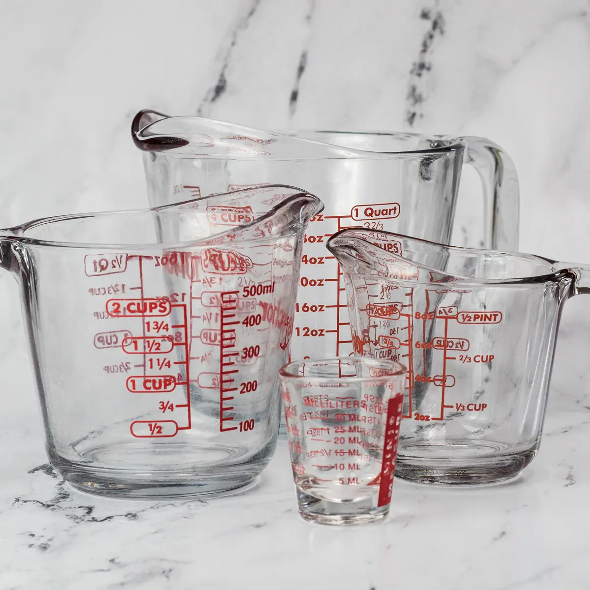Liquid measuring cup sizes showing ounces in a quart.